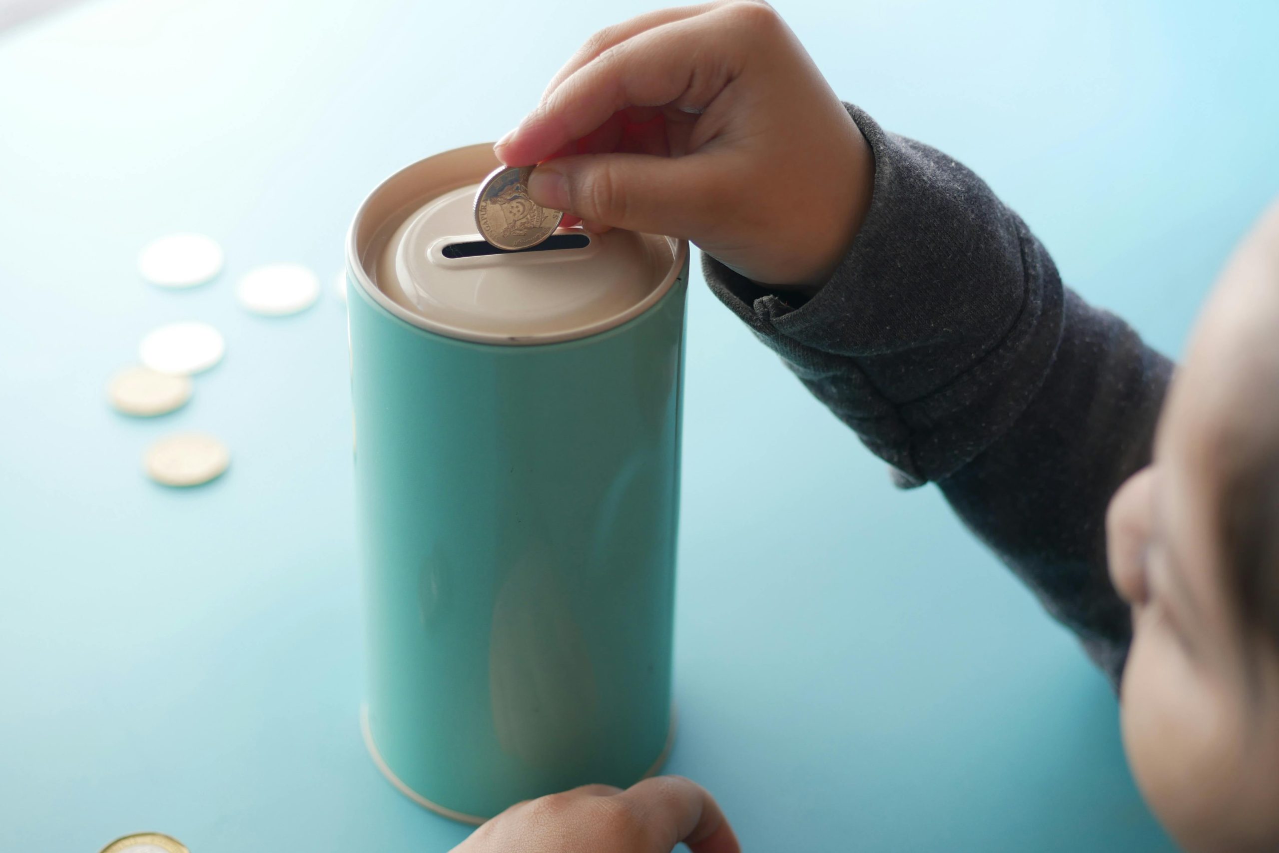 Youth Saving Piggy Bank